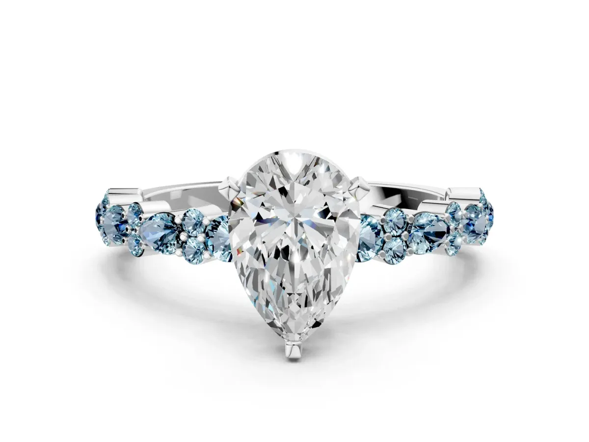 Pear Cut Diamond Side Stone Solitaire Ring with Round Aquamarine and Four-Prong Setting Silver