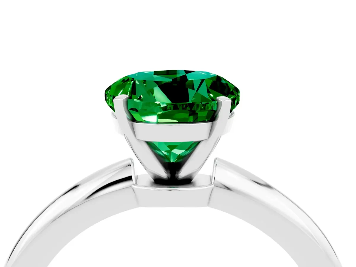 Round Cut Emerald Solitaire Ring with Six-Prong Setting and Classic Band Platinum