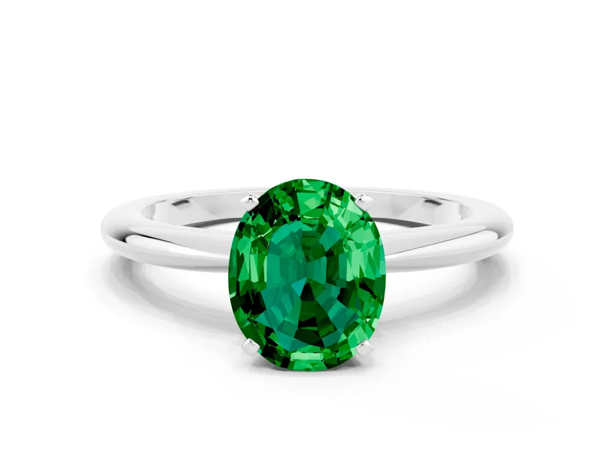 Oval Cut Emerald Solitaire Ring with Six-Prong Setting and Classic Band Silver