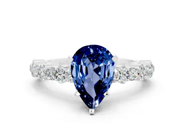 Pear Cut Blue Sapphire Side Stone Solitaire Ring with Round and Four-Prong Setting White gold