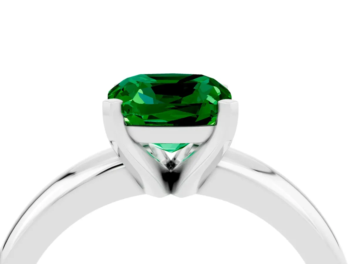 Cushion Cut Emerald Solitaire Engagement Ring with Round Band and Four-Prong Setting Silver