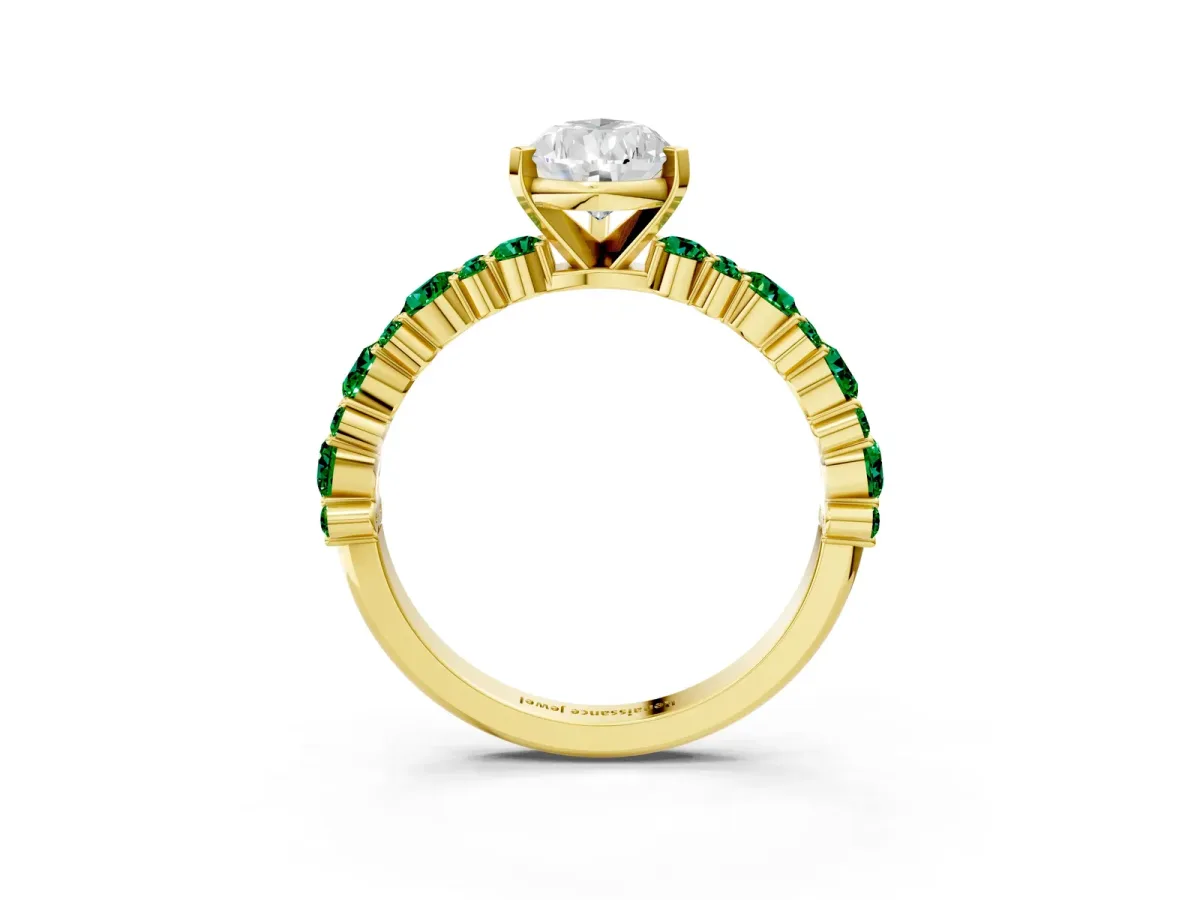 Pear Cut Diamond Side Stone Solitaire Ring with Round Emerald and Four-Prong Setting Yellow gold