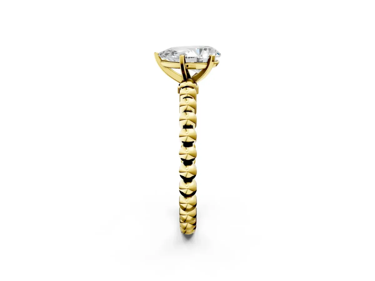 Pear Cut Diamond Solitaire Ring with Beaded Band and Prong Setting Yellow gold