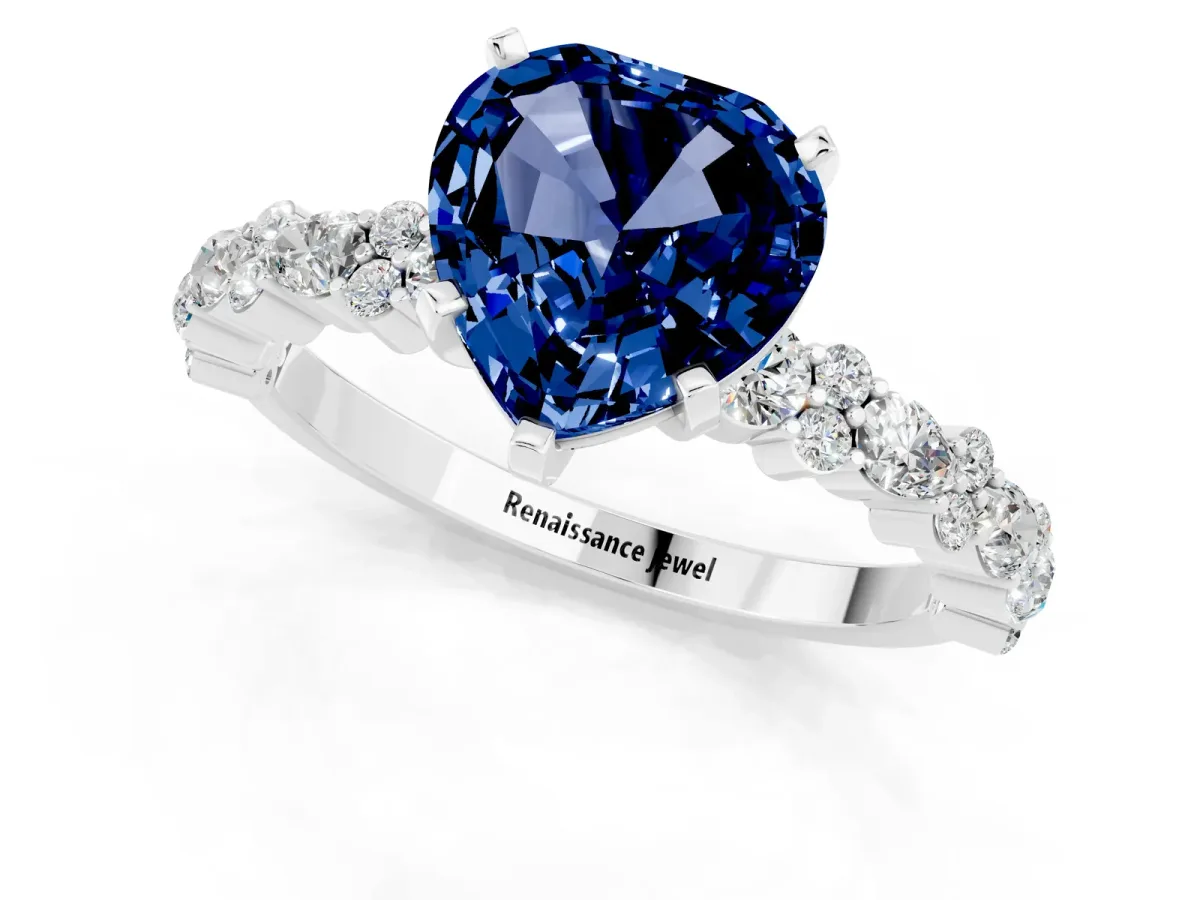 Heart Cut Blue Sapphire Side Stone Solitaire Ring with Round and Four-Prong Setting Platinum