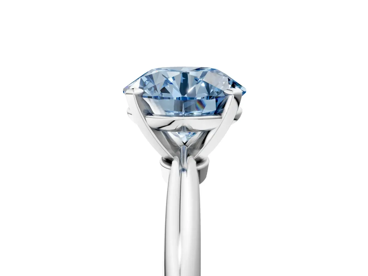 Fancy Blue Round Cut Diamond Solitaire Ring with Six-Prong Setting and Classic Band Silver