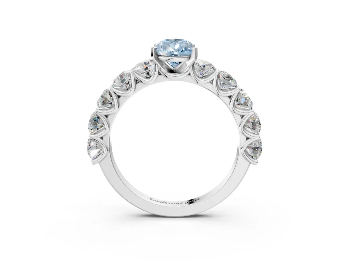 Fancy Blue Pear Cut Diamond Prong Setting with Side Stones on a Pave Band Platinum
