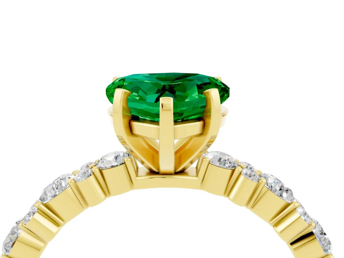 Heart Cut Emerald Side Stone Solitaire Ring with Round and Four-Prong Setting Yellow gold