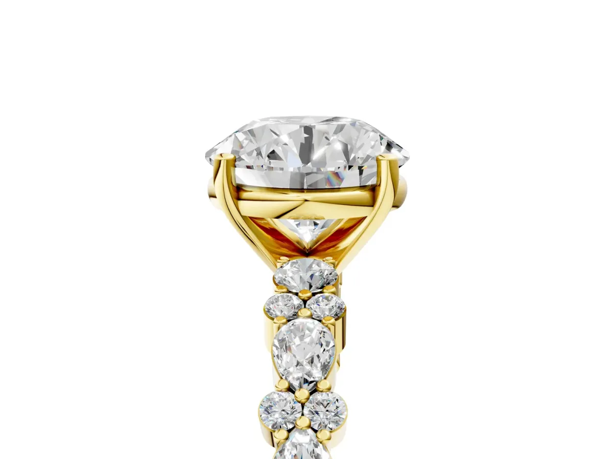 Round Cut Diamond Side Stone Solitaire Ring with Round and Four-Prong Setting Yellow gold