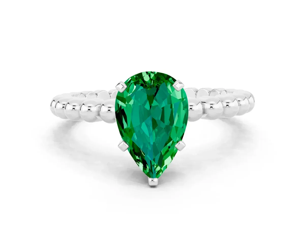 Pear Cut Emerald Solitaire Ring with Beaded Band and Prong Setting White gold