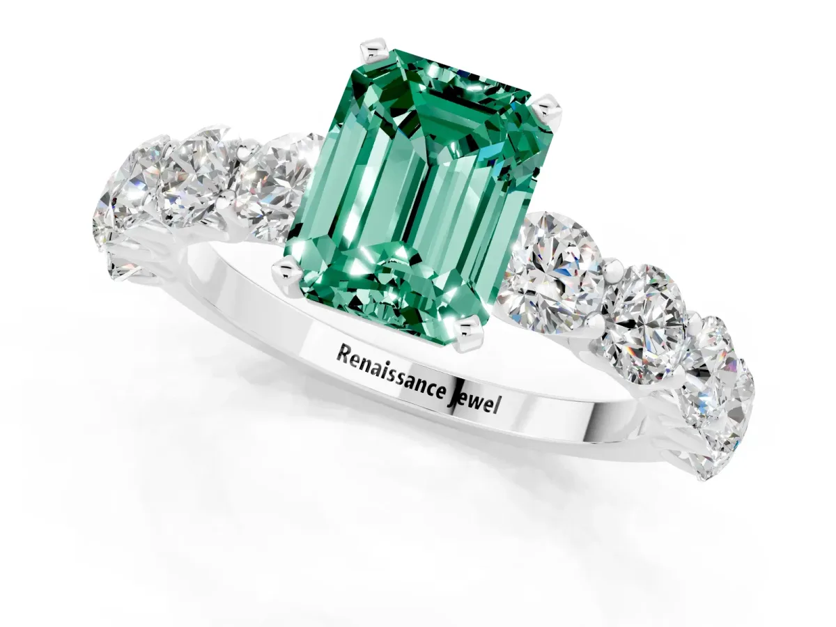Emerald Cut Green Sapphire Prong Setting with Side Stones on a Pave Band Silver