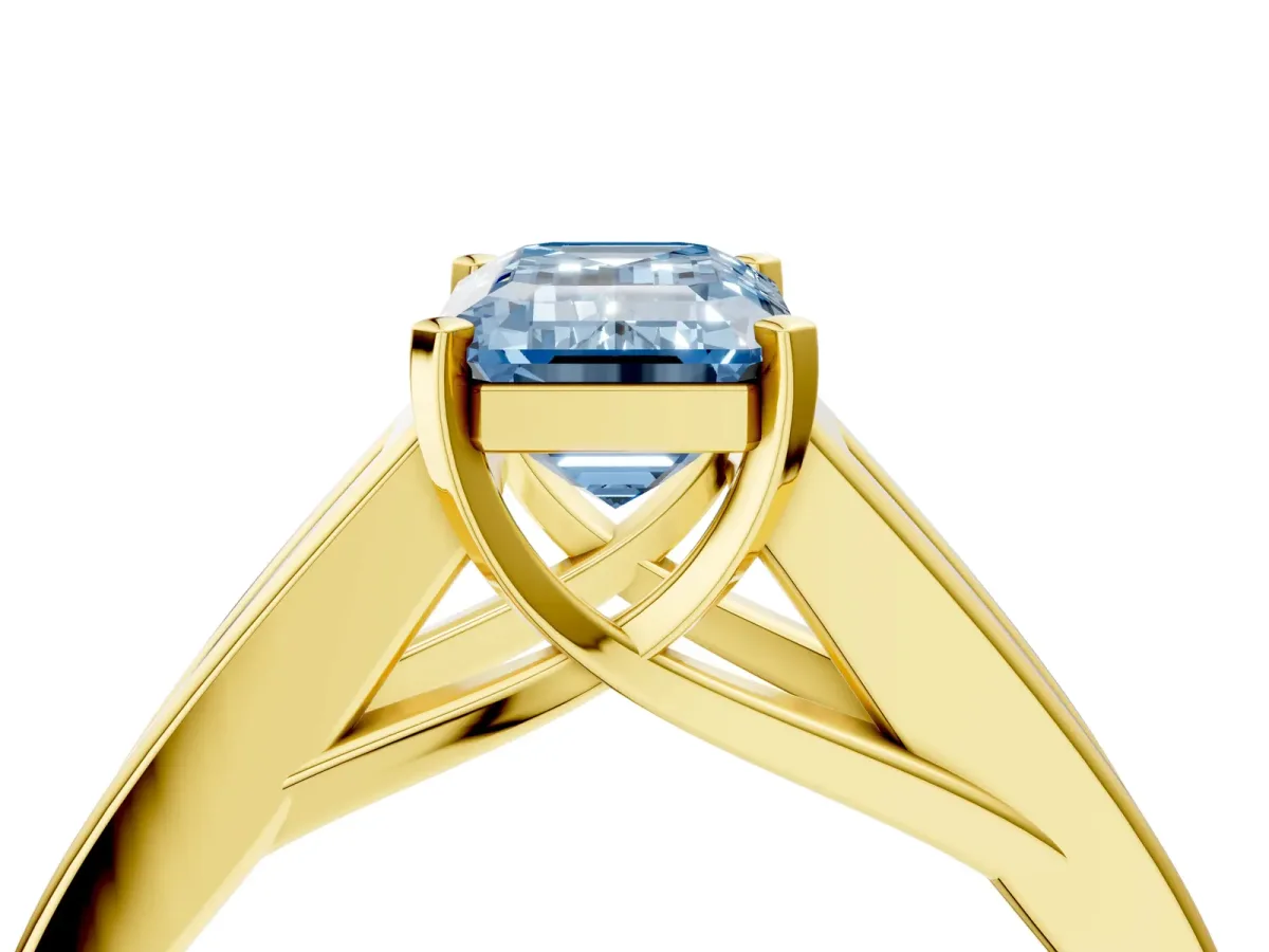Fancy Blue Emerald Cut Cut Channel Set Solitaire Ring with Four-Prong Setting Yellow gold