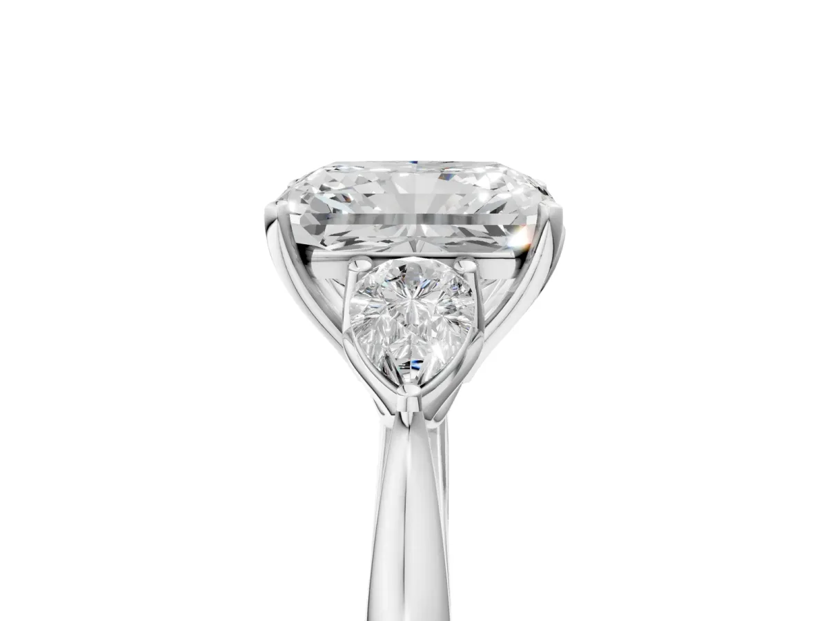Three-Stone Radiant Cut Diamond Ring with Pear Side Stones in Four-Prong Setting Platinum