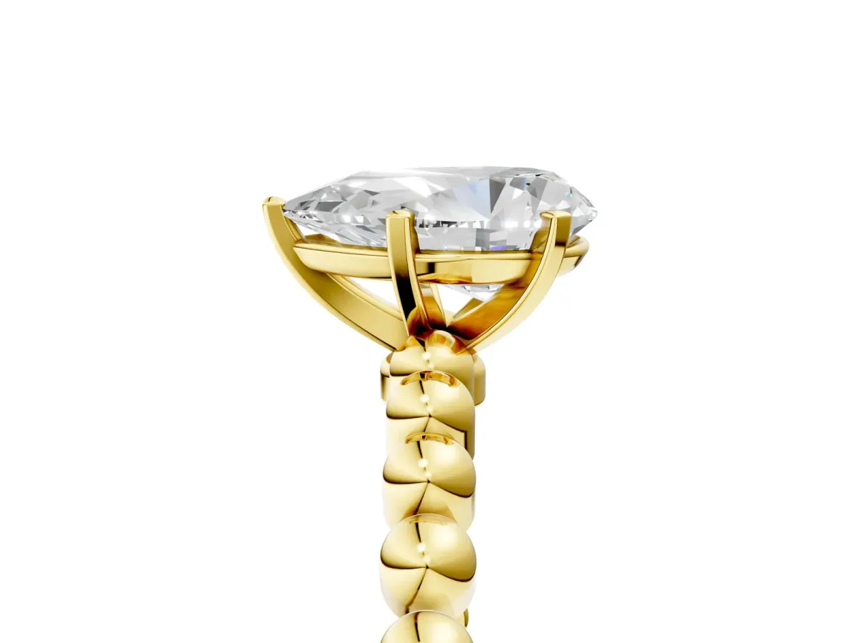 Pear Cut Diamond Solitaire Ring with Beaded Band and Prong Setting Yellow gold
