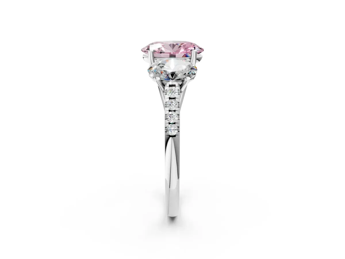 Fancy Pink Three-Stone Oval Cut Diamond Ring with Round Pavé Band and Prong Setting Silver