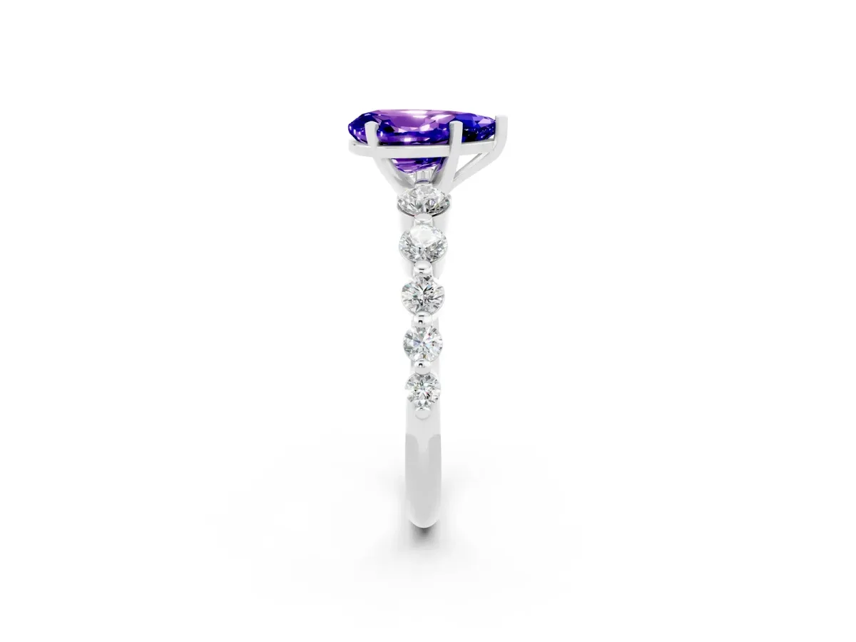Pear Cut Solitaire Tanzanite Ring with Pave Band and Four-Prong Setting Silver