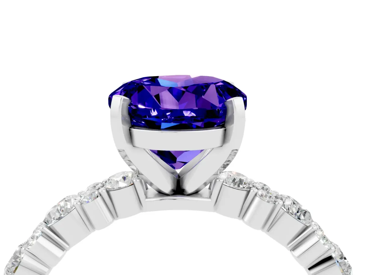 Round Cut Tanzanite Side Stone Solitaire Ring with Round and Four-Prong Setting Silver