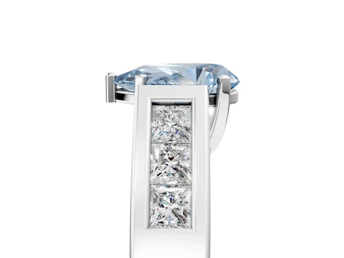 Fancy Blue Pear Cut Cut Channel Set Solitaire Ring with Four-Prong Setting Silver