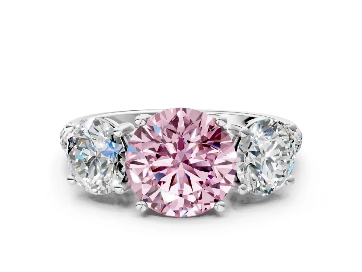 Fancy Pink Three-Stone Round Cut Diamond Ring with Round Pavé Band and Prong Setting Silver
