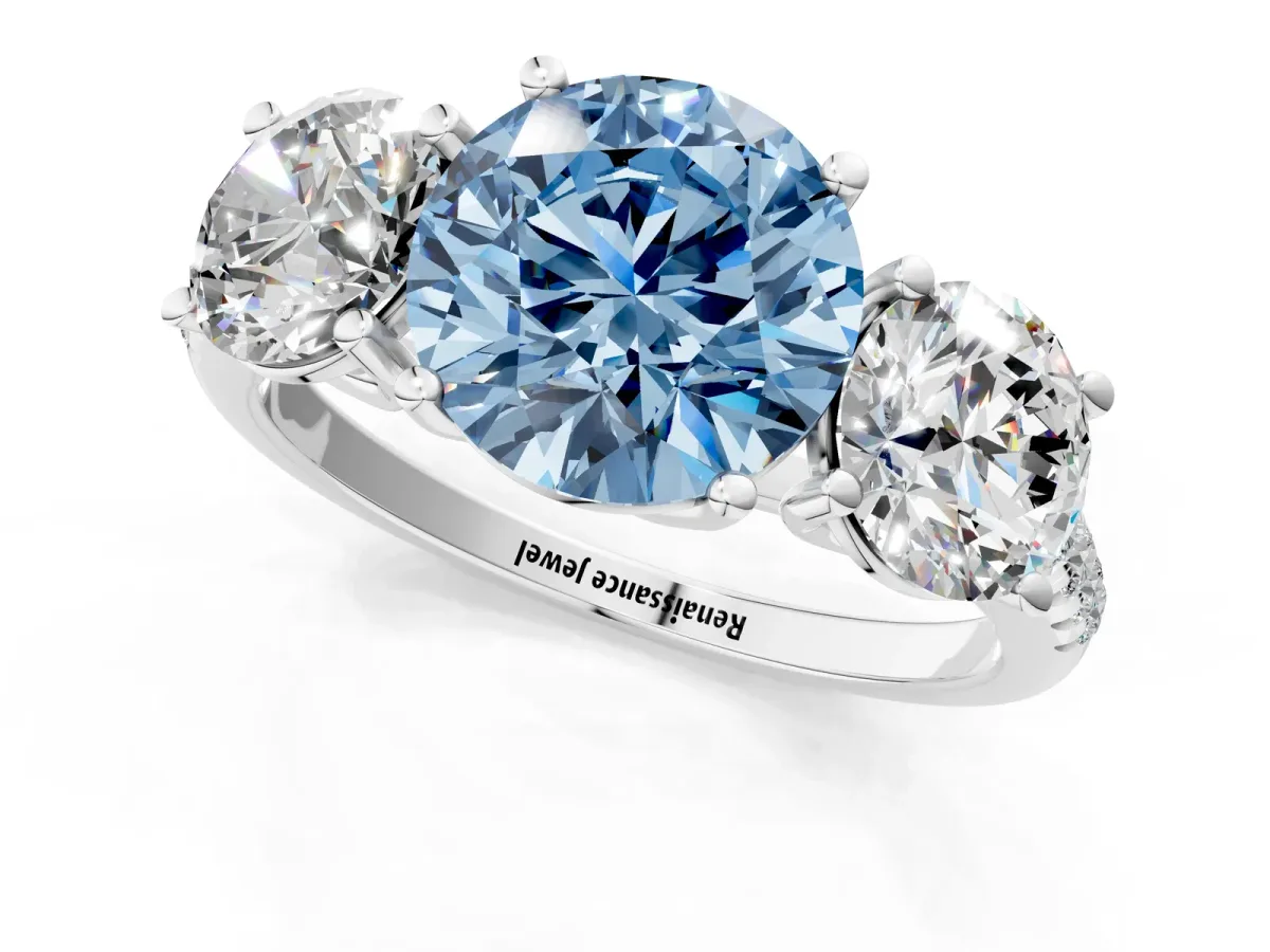 Fancy Blue Three-Stone Round Cut Diamond Ring with Round Pavé Band and Prong Setting Platinum