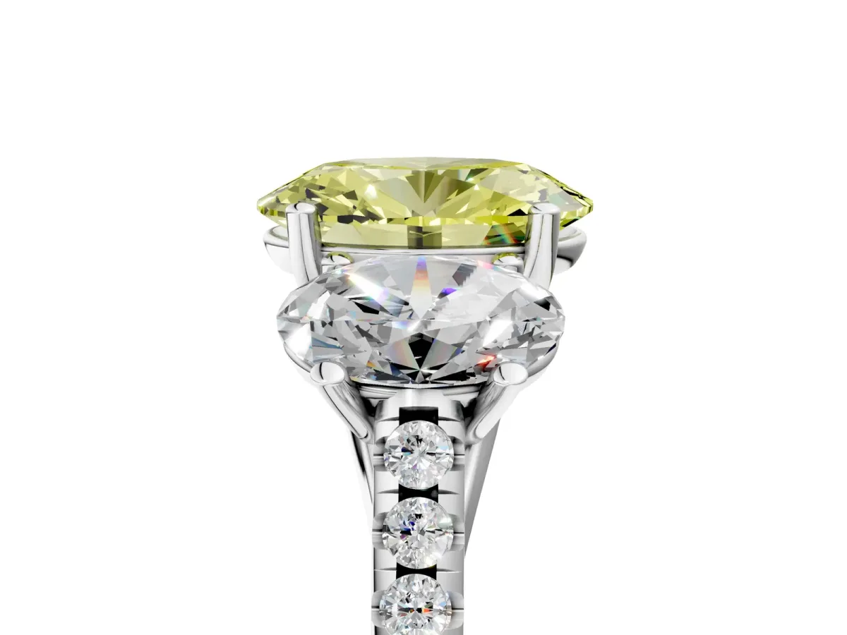 Fancy Yellow Three-Stone Oval Cut Diamond Ring with Round Pavé Band and Prong Setting Platinum