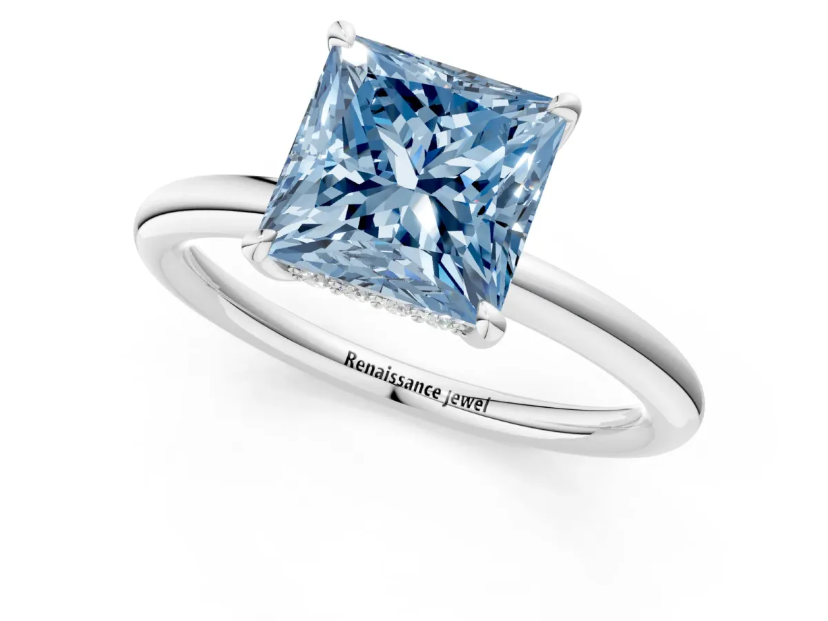 Fancy Blue Princess Cut Diamond Solitaire Ring with Thin Band and Four-Prong Setting White gold