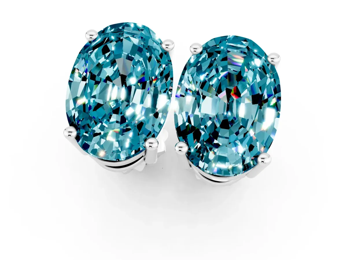 Oval Cut Blue Topaz Stud Earrings Silver