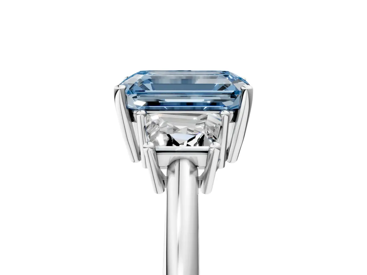 Fancy Blue Emerald Cut Diamond Three-Stone Ring with Trapezoid Side Stones and Prong Setting Silver