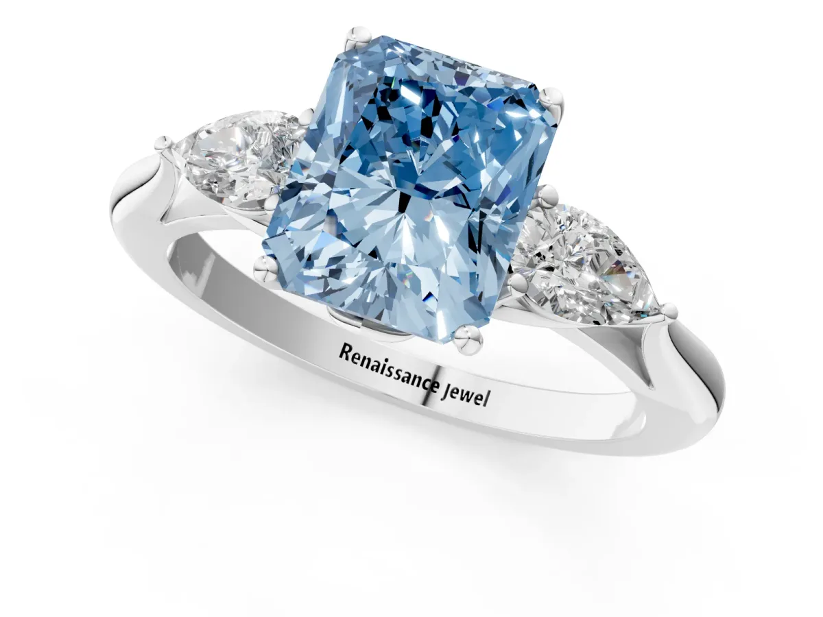 Fancy Blue Three-Stone Radiant Cut Diamond Ring with Pear Side Stones in Four-Prong Setting Platinum