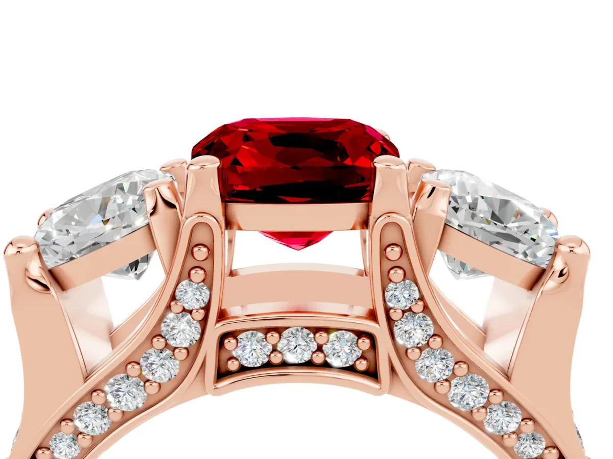 Cushion Cut Ruby Three-Stone Ring with Channel Set Band and Four-Prong Setting Rose gold