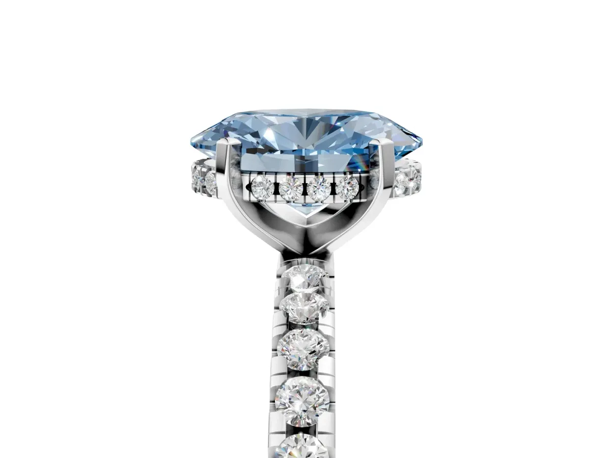 Fancy Blue Oval Cut Diamond Solitaire Ring with Round Pavé Band and Four-Prong Setting Silver