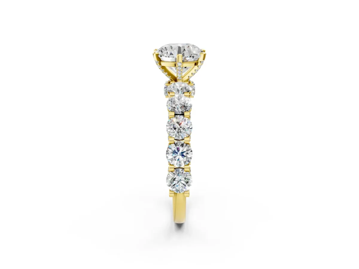 Round Cut Diamond Side Stone Engagement Ring with Four-Prong Setting Yellow gold