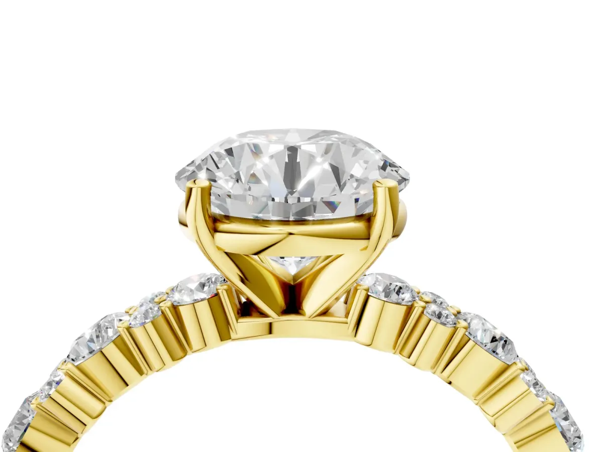 Round Cut Diamond Side Stone Solitaire Ring with Round and Four-Prong Setting Yellow gold