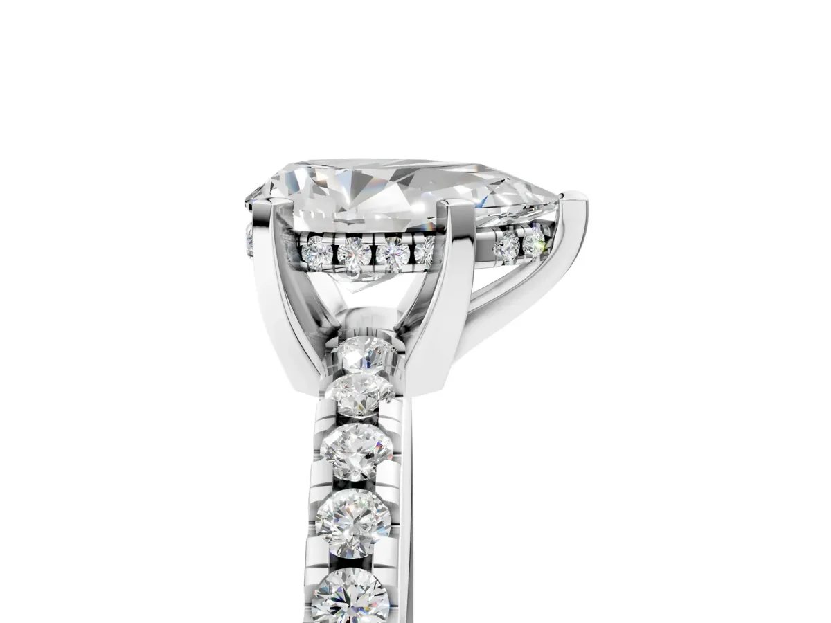 Pear Cut Diamond Solitaire Ring with Round Pavé Band and Four-Prong Setting Platinum