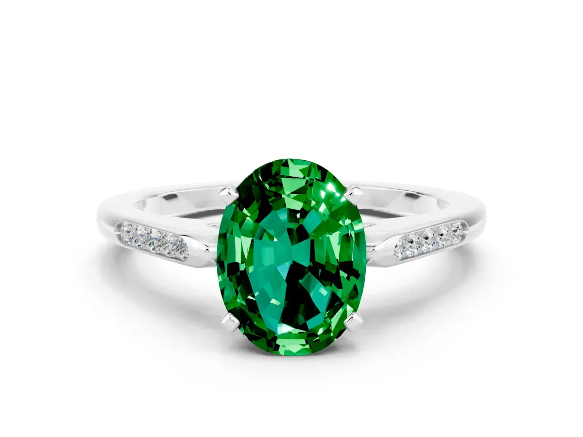 Oval Cut Emerald Solitaire Ring with Channel Set Round Band and Prong Setting White gold
