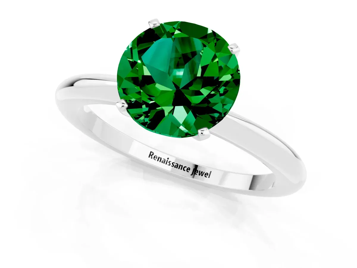 Round Cut Emerald Solitaire Ring with Six-Prong Setting and Classic Band Platinum