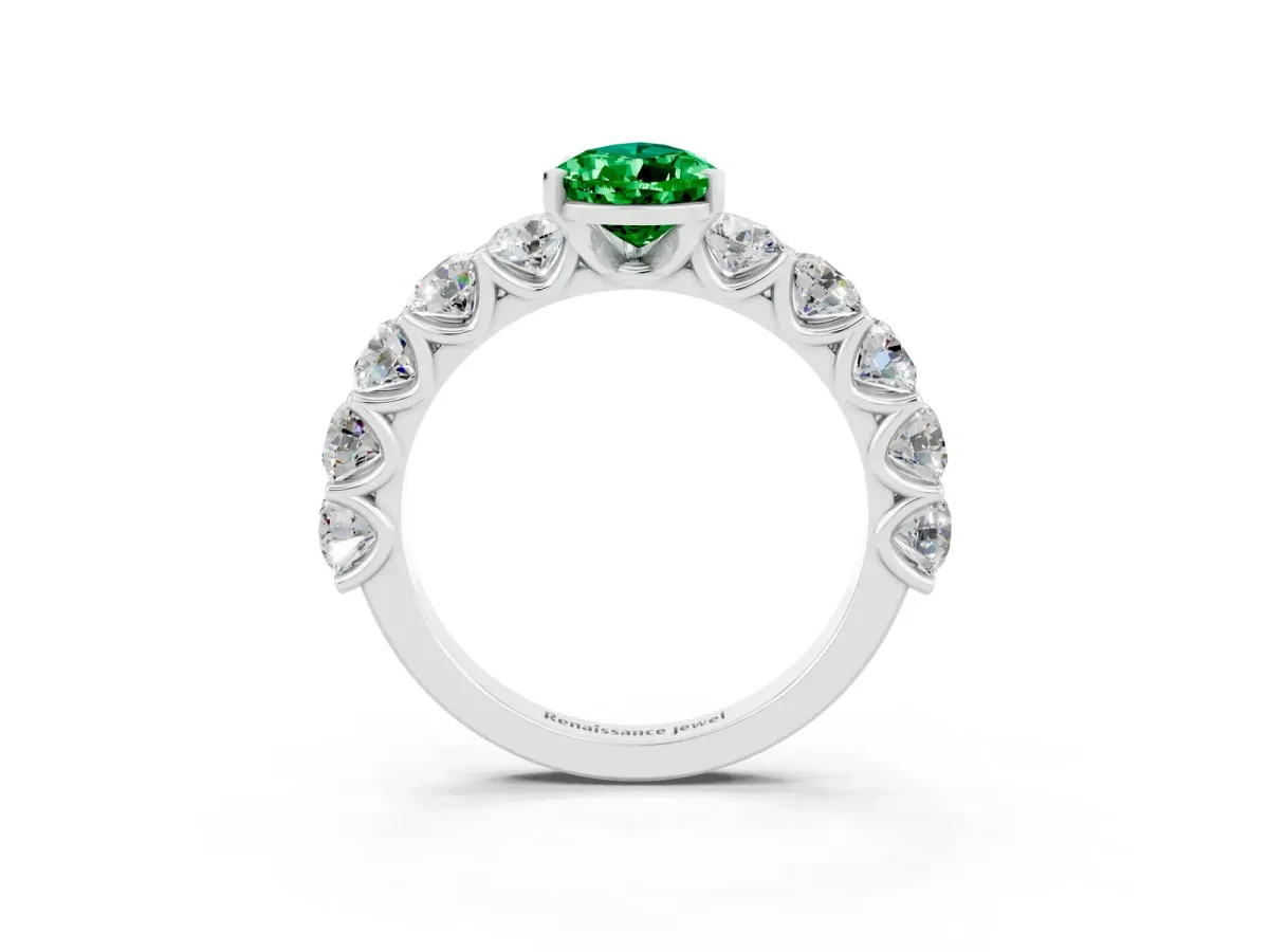 Pear Cut Emerald Prong Setting with Side Stones on a Pave Band Silver