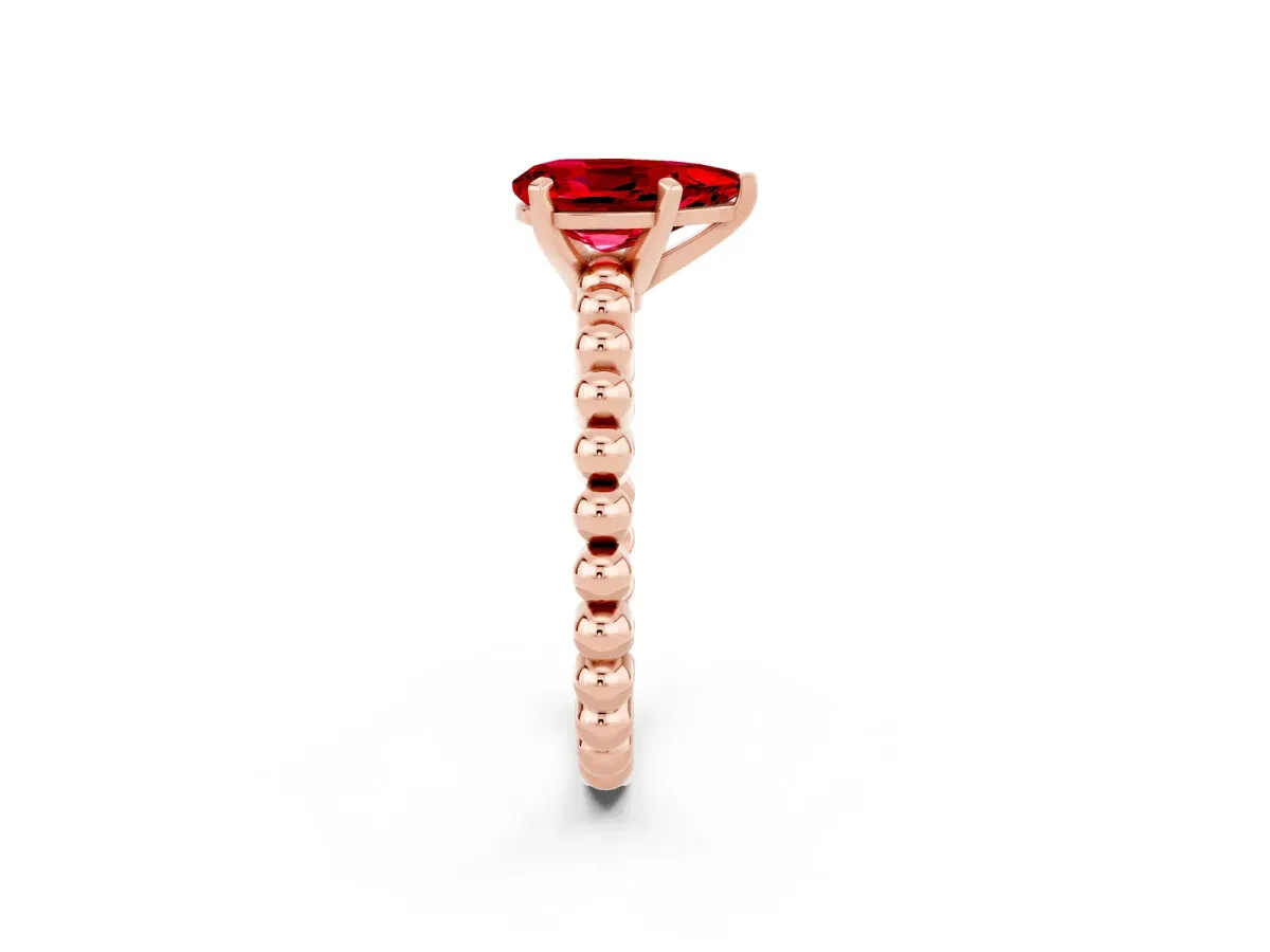 Pear Cut Ruby Solitaire Ring with Beaded Band and Prong Setting Rose gold