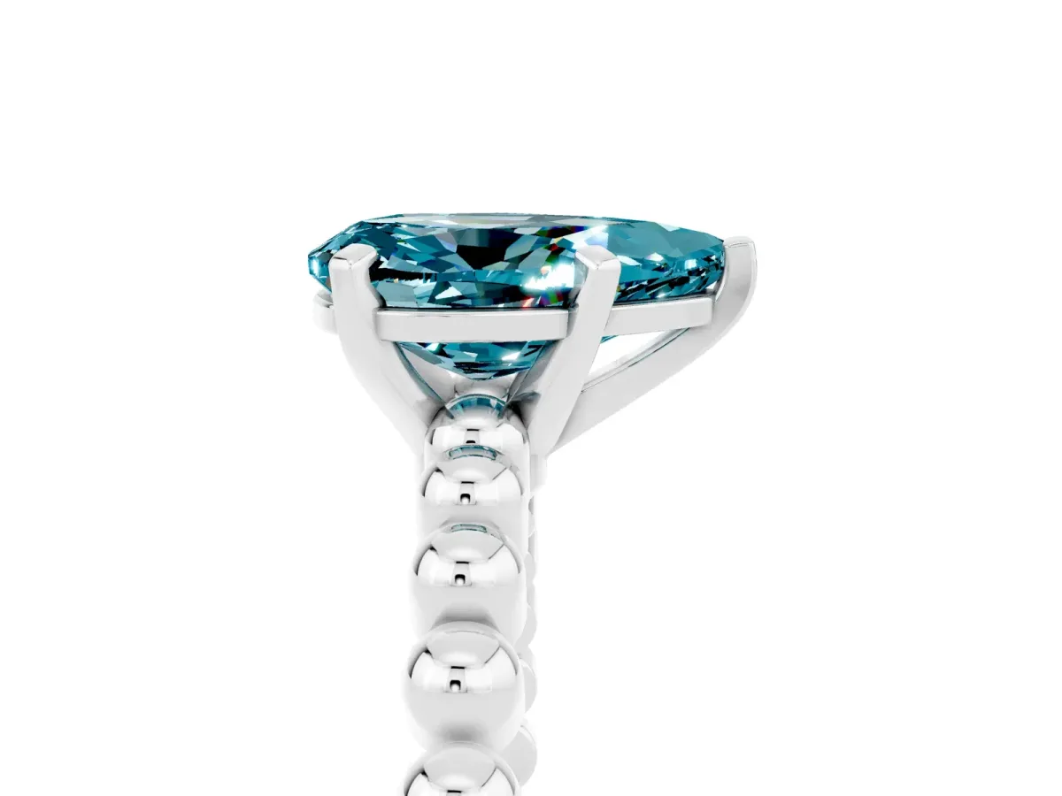 Pear Cut Blue Topaz Solitaire Ring with Beaded Band and Prong Setting Silver