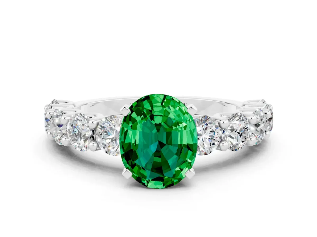 Oval Cut Emerald Prong Setting with Side Stones on a Pave Band Platinum