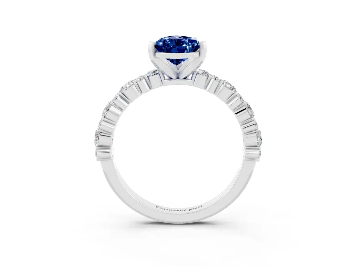 Pear Cut Blue Sapphire Side Stone Solitaire Ring with Round and Four-Prong Setting Silver