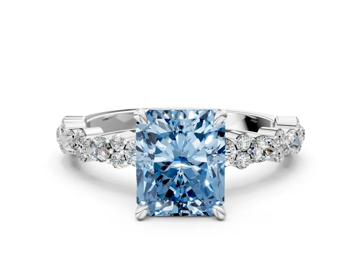 Fancy Blue Radiant Cut Diamond Side Stone Solitaire Ring with Round and Four-Prong Setting Platinum