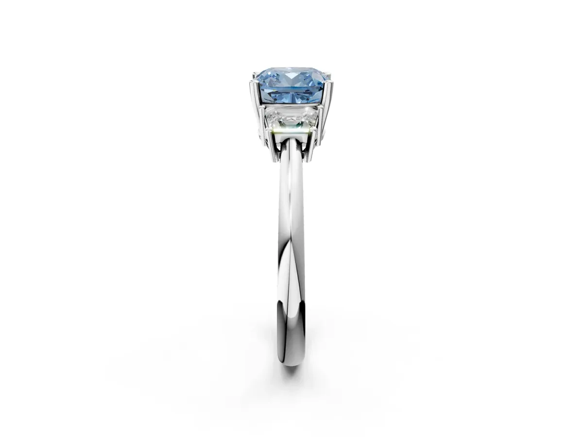 Fancy Blue Cushion Cut Diamond Three-Stone Ring with Trapezoid Side Stones and Prong Setting Platinum