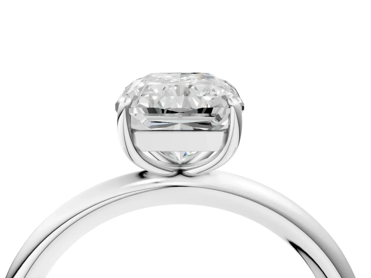 Radiant Cut Solitaire Diamond Ring with Four-Prong Setting on a Plain Band Platinum