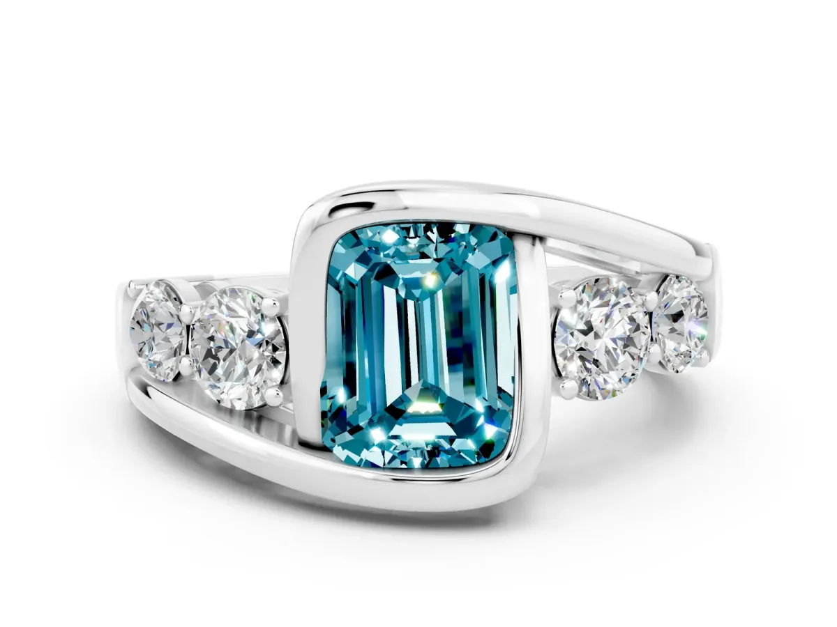 Bezel Set Emerald Cut Blue Topaz Bypass Ring with Round Accents Platinum