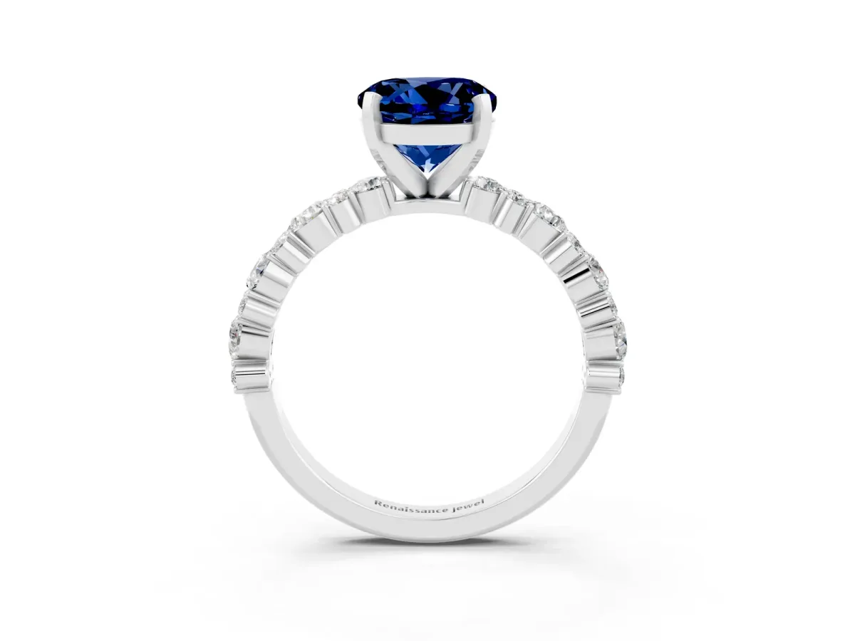 Round Cut Blue Sapphire Side Stone Solitaire Ring with Round and Four-Prong Setting Platinum
