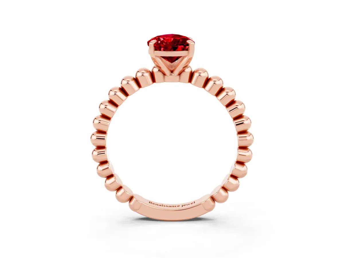 Pear Cut Ruby Solitaire Ring with Beaded Band and Prong Setting Rose gold