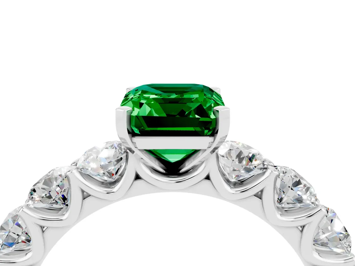Emerald Cut Emerald Prong Setting with Side Stones on a Pave Band Platinum