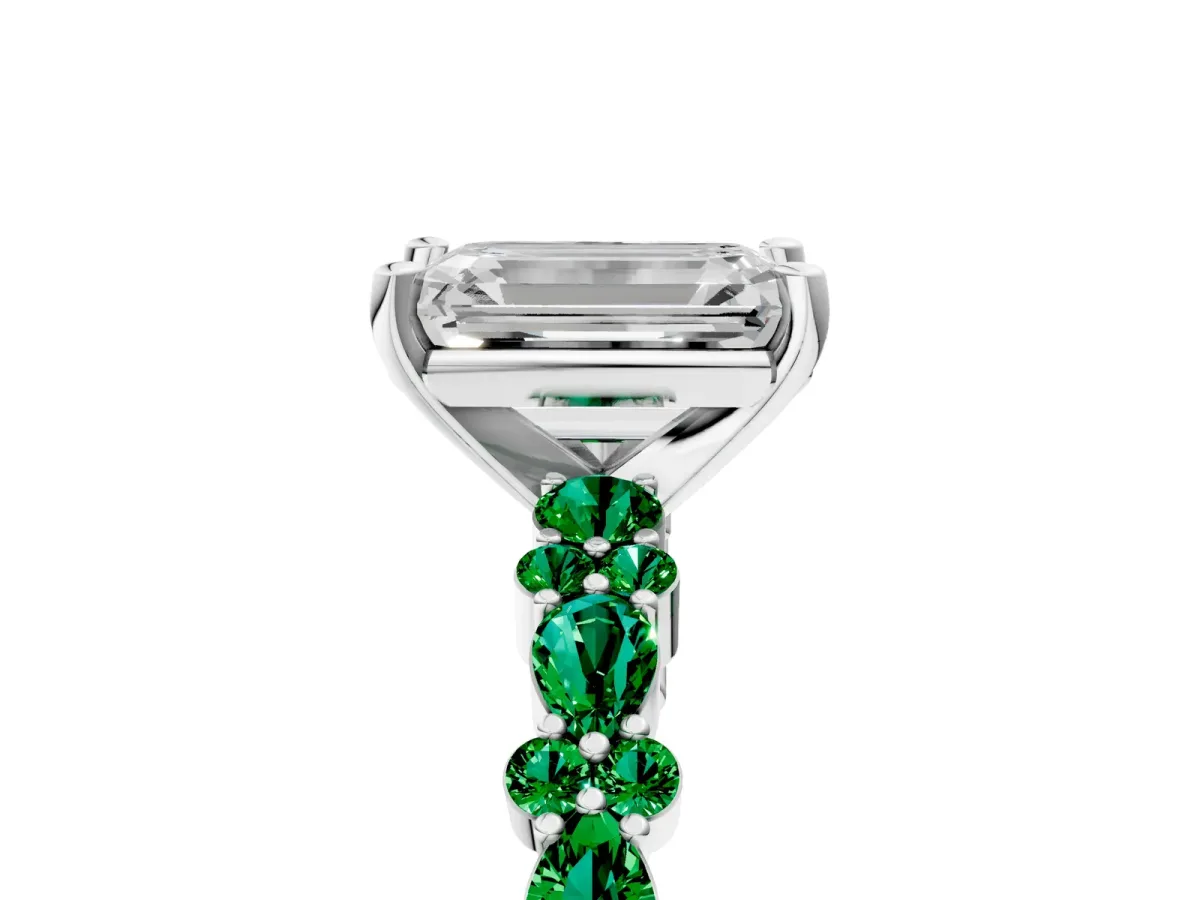 Emerald Cut Diamond Side Stone Solitaire Ring with Round Emerald and Four-Prong Setting Platinum