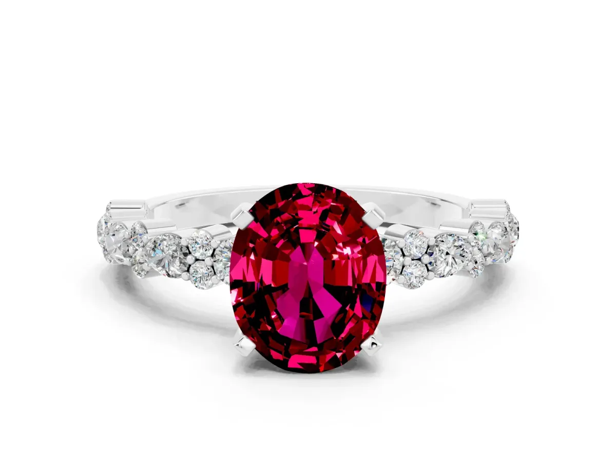 Oval Cut Garnet Side Stone Solitaire Ring with Round and Four-Prong Setting Silver