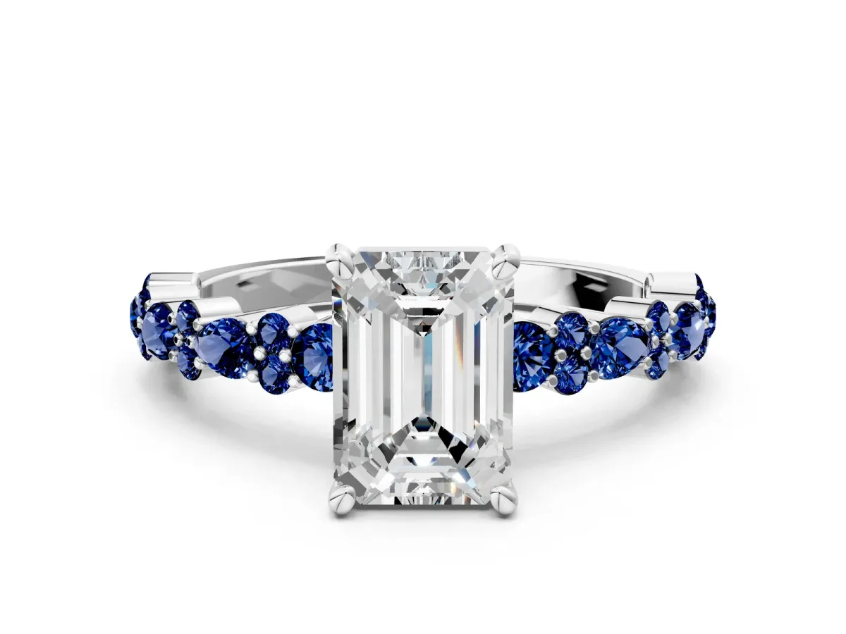Emerald Cut Diamond Side Stone Solitaire Ring with Round Blue Sapphire and Four-Prong Setting Platinum